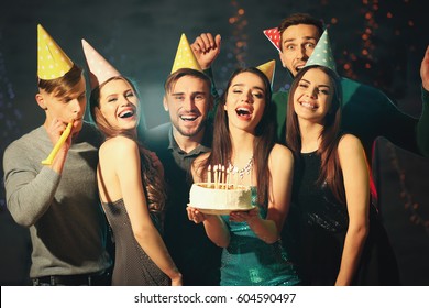 Friends Having Fun At Birthday Party In Night Club