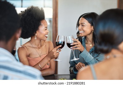 Friends having fun and drinking wine, toasting, bonding and celebrating at an event or party. Diverse friends cheers and laughing, enjoying free time, dining experience and wine tasting gathering - Powered by Shutterstock