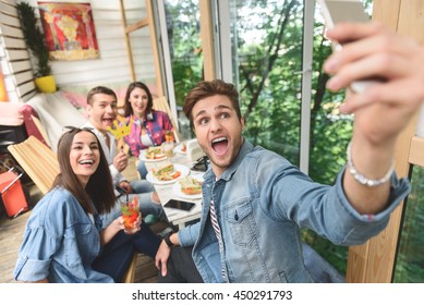 Friends Having Fun During Lunch Together