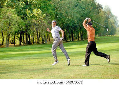 Friends Having Fun In Golf Course