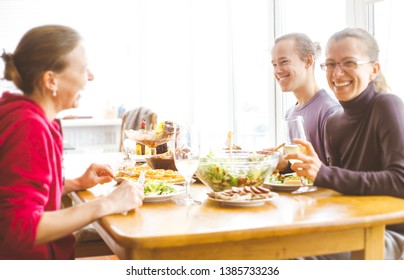 Friends Having Fun At Home At Dinner, Laughing. 