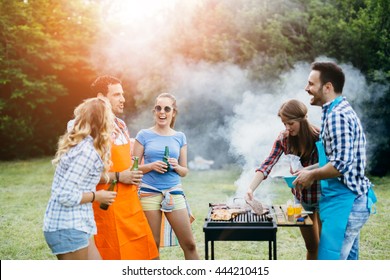 Friends Having Fun In Nature Doing Bbq