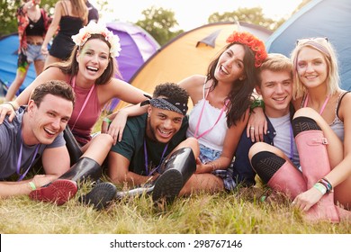 Friends having fun on the campsite at a music festival - Powered by Shutterstock