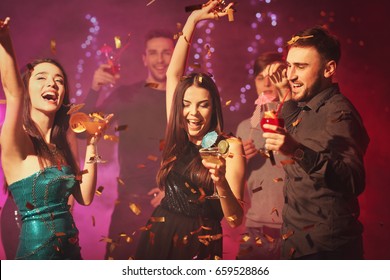 Friends having fun at party in night club - Shutterstock ID 659528866