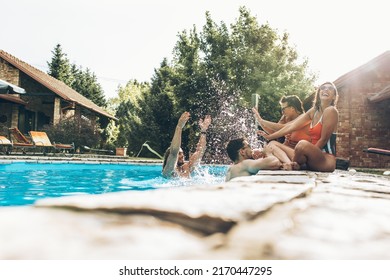 Friends are having fun and playing in the swimming pool.They are smiling and joying on a hot summer day.	
 - Powered by Shutterstock