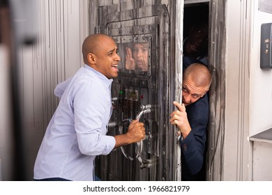 Friends Having Fun In Quest Room, Panicky Trying To Close Door And Simultaneously To Get Into Room