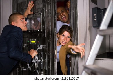 Friends Having Fun In Quest Room, Panicky Trying To Close Door And Simultaneously To Get Into Room