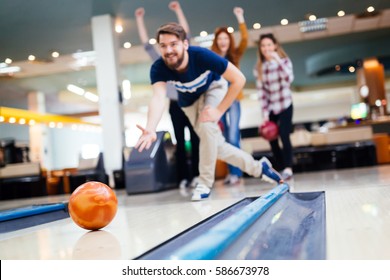 Friends having fun while bowling and spending time together