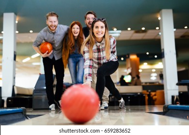 Friends Having Fun While Bowling