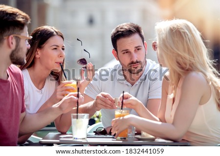 Similar – Infused fruit water cocktails and people talking in background