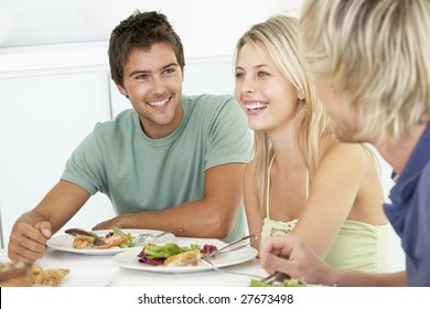 Friends Having Lunch Together At Home