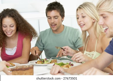 Friends Having Lunch Together At Home