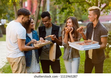 Friends having a pizza party. Summer holiday, festive atmosphere, buddies and yummy food. - Powered by Shutterstock