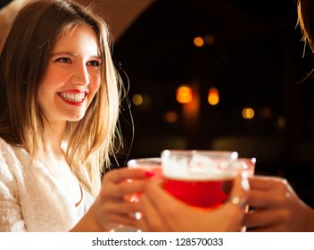 Friends having a round of drinks in a night club