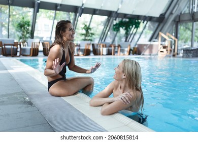 Friends Having Wellness Weekend At Spa Swimming Pool 