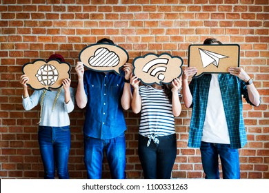 Friends holding social media icons - Shutterstock ID 1100331263