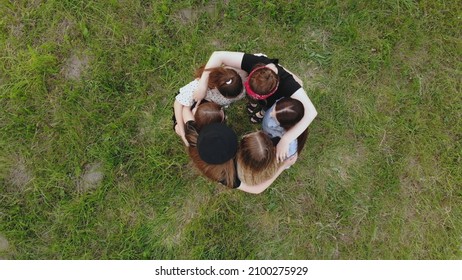 Friends Hug In The Park On A Summer Day. View From Above.