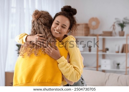 Similar – Image, Stock Photo young lesbian couple hugging at sunset outdoors. Lifestyle and pride concept. love is love