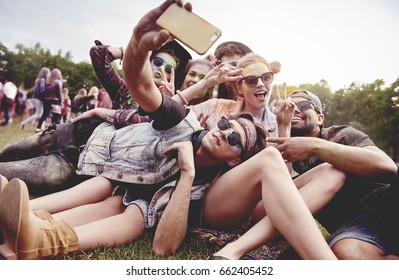 Friends making selfie at the summer festival - Powered by Shutterstock