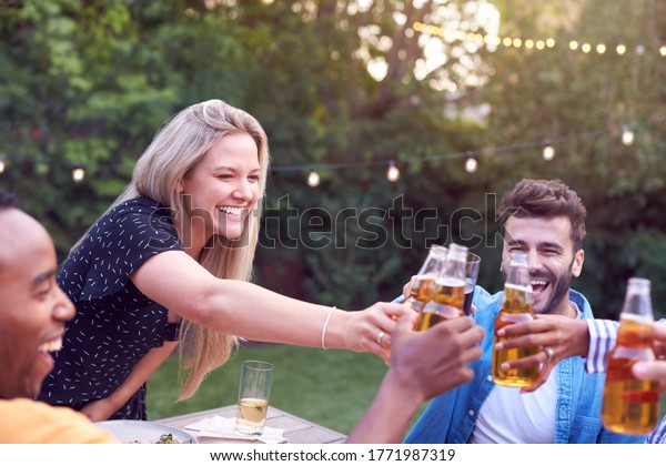 Friends Making Toast With Alcohol In Garden At Home
Enjoying Summer Garden
Party