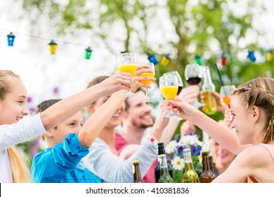 Friends And Neighbors Toasting On Garden Party