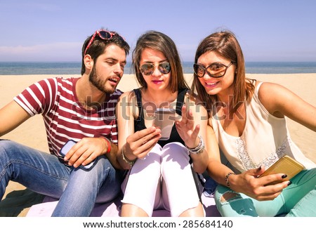 Similar – Young happy people looking tablet over table