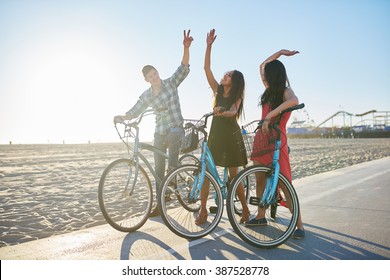 Friends On Bike Doing High Five Together