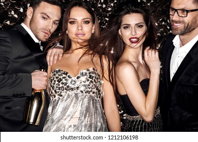 Friends on celebrating, party. Hollywood stars. Shine background.