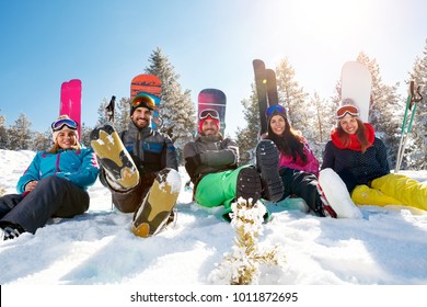 Friends On Mountain Enjoying On Sunny Winter Day