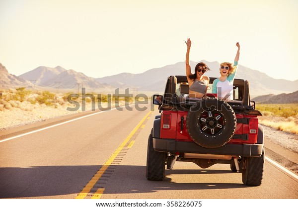 Friends On Road\
Trip Driving In Convertible\
Car
