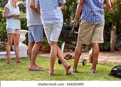 Friends Outdoors At Garden Barbecue Party Gathering