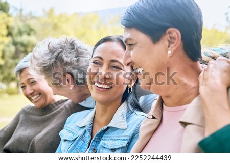 Friends, park and senior women laughing at funny joke, crazy meme or comedy outdoors. Comic, face and happy group of retired females with humor bonding, talking and enjoying time together in nature.