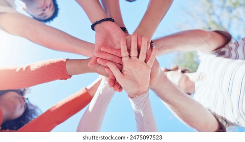 Friends, people and hands together with low angle outdoor for teamwork, unity and support in nature. Group, team building and solidarity for collaboration, partnership and motivation with diversity - Powered by Shutterstock