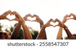 Friends, people and team with heart hands outdoor for love, care and thank you for charity by sky. Group, support and community with peace gesture for kindness, connection sign or emoji for gratitude