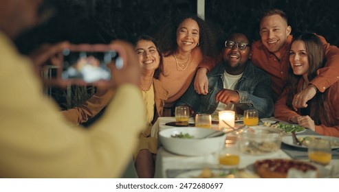 Friends, photography and outdoor dinner with phone, patio or happy for new years eve celebration on blog. Women, men and group with sign, icon and hug with smartphone screen for post on social media - Powered by Shutterstock