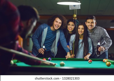 Friends Play Billiards In Bar.