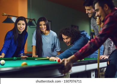 Friends Play Billiards In Bar.