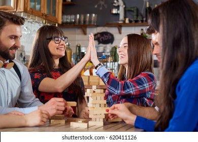 Friends Play Table Games At The Table