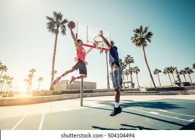 Friends playing basketball - Afro-american players having a friendly match outdoors - Powered by Shutterstock