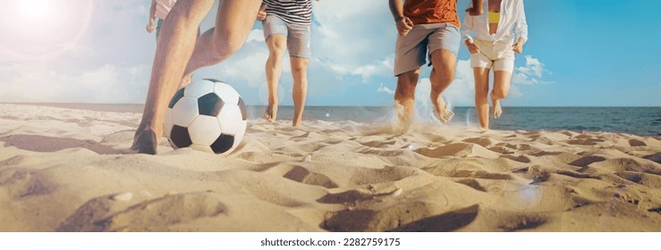 Friends playing football on beach during sunny day, closeup. Banner design - Powered by Shutterstock