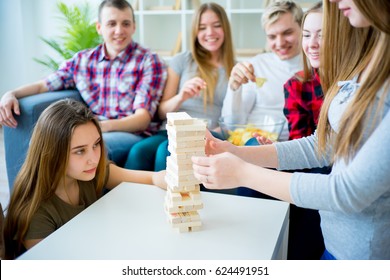 Friends Playing Jenga