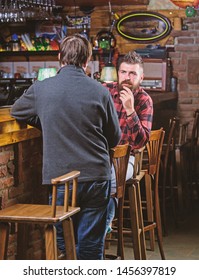 Friends Relaxing In Pub. Friendly Conversation With Stranger. Hipster Brutal Bearded Man Spend Leisure With Friend Bar Counter In Pub. Men Relaxing In Pub. Weekend Leisure. Friday Relaxation In Pub.