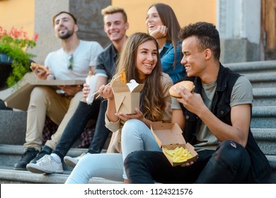 Friends Are Resting And Eating Favorite Food: Pizza, Noodles, French Fries And Hamburger. Takeout, Takeaway Food, Bad Eating Habits.