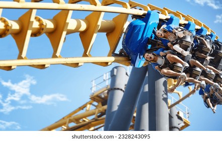 Friends riding amusement park ride