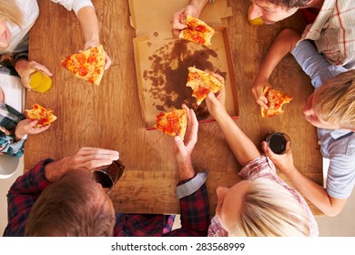 Friends Sharing A Pizza Together, Overhead View