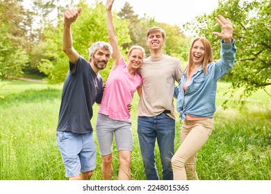Friends or siblings laugh and wave exuberantly on an excursion in nature - Shutterstock ID 2248015365