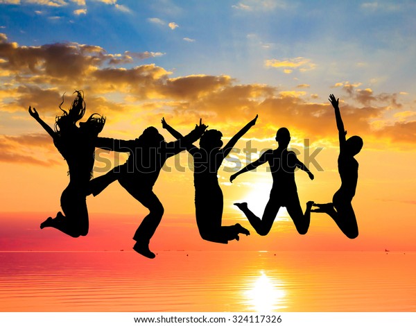 Friends Silhouettes Jumping Over Sunset Stock Photo (edit Now) 324117326