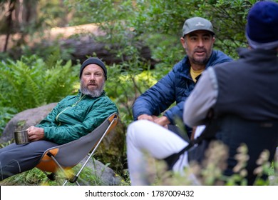 Friends Sitting By A Creek Enjoying Some Breakfast Coffee In Kings Canyon National Park. 