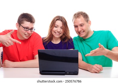 Friends sitting at a computer and pointing