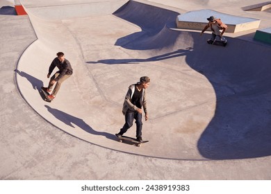 Friends, sports and men with skateboard, ramp or bowl action at a skate park for stunt training. Freedom, adrenaline and gen z skater people with energy, balance or skill, exercise or performance - Powered by Shutterstock